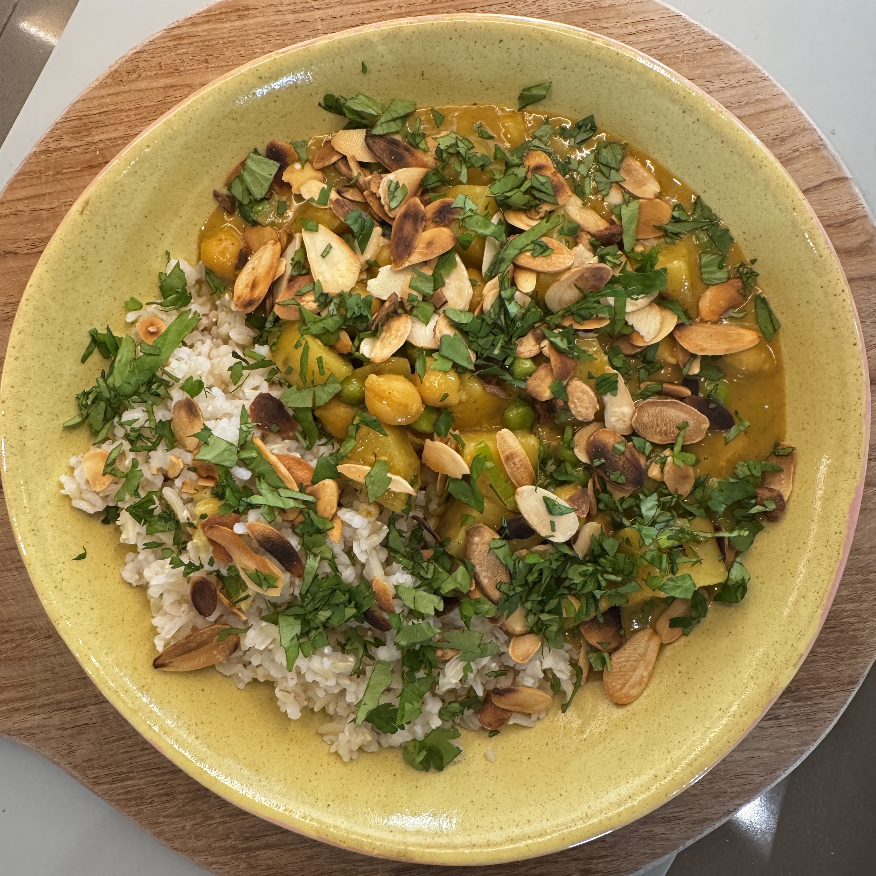 Sweet potato & chickpea curry with coconut milk, toasted almonds and fresh coriander